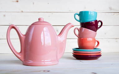 teapot and cup on a wooden tray