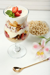 Natural yogurt with fresh berries on wooden table