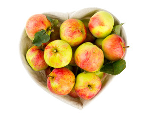 heart-shaped basket of apples