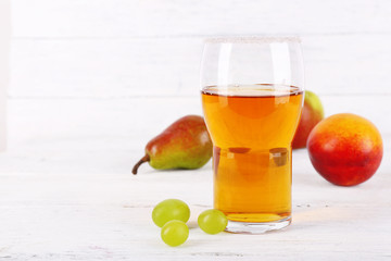 tasty summer drink with fresh fruits, on wooden table