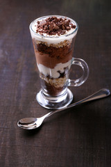 Yogurt, with chocolate cream, chopped chocolate and muesli