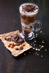 Yogurt, with chocolate cream, chopped chocolate and muesli