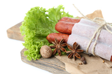 Smoked thin sausages  with lettuce salad leaves and spices