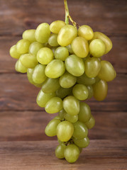 Bunch of grape on wooden background