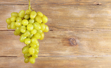 Bunch of grape on wooden background