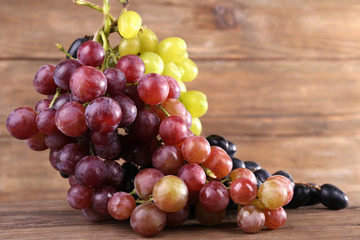 Bunches of grapes on wooden background