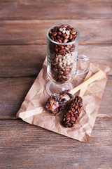 Glass and spoons with coffee beans