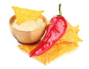 Tasty nachos and bowl with sauce isolated on white