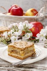 Piece of apple cake with whipped cream