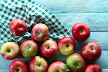 Juicy apples on wooden table, close-up