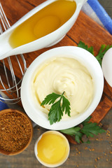 Mayonnaise ingredients on wooden background