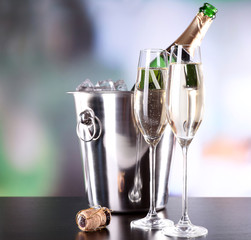 Champagne in glasses and bottle in restaurant