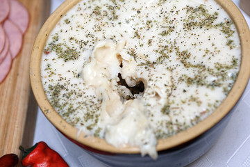 Lard with marjoram in a stone bowl