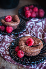 Chocolate cakes with raspberries, selective focus