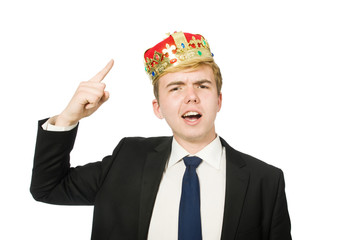 Businessman with crown isolated on white