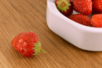 Fresh ripe strawberries on a vintage wooden background