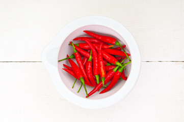 Red hot pepper in the ceramic bowl