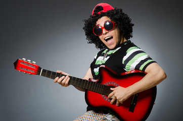 Obraz premium man with funny haircut and guitar