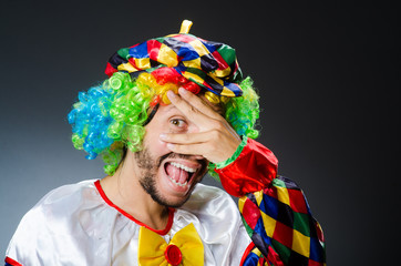 Funny clown in colourful costume