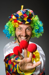 Fototapeta na wymiar Funny clown in colourful costume
