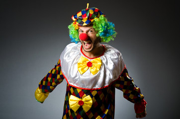 Funny clown in colourful costume