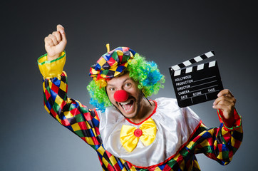 Clown with movie clapper board