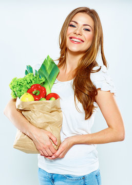 woman hold shopping bag with green vegan food