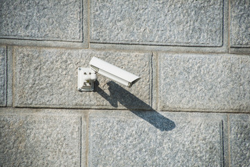 Security camera attached to the wall