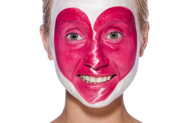 Woman with heart face painting isolated on white