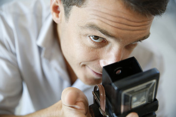 Fototapeta premium Closeup of photographer using vintage camera