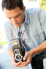 Photographer using vintage camera