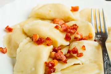 Closeup dumplings sprinkled with pork scratchings