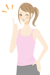 ポイントを指差すスポーツウェアの女性