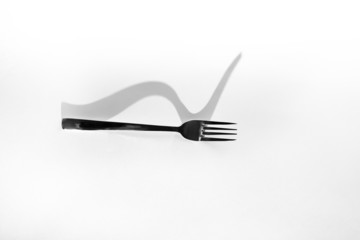Abstract image for kitchen. Fork shadow
