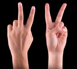 Hand showing the sign of victory and peace
