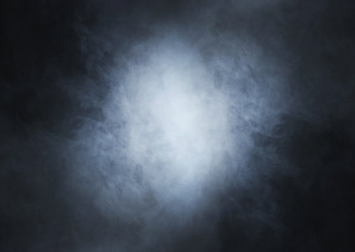 Light blue smoke on a black background