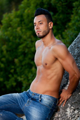 Handsome muscular man on the beach.