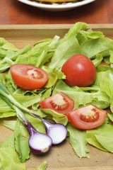 Fresh green salad with tomato and onion