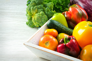 Assortment of fresh vegetables on wooden table