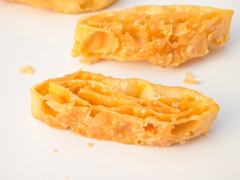 Closeup of crispy fried roti coating with sweety butter caramel