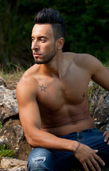 Handsome muscular man on the beach.