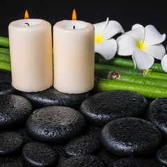 Obraz na płótnie Canvas spa concept of zen basalt stones, two white flower frangipani, c