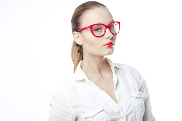 Business woman in glasses and a bright white shirt on a white ba