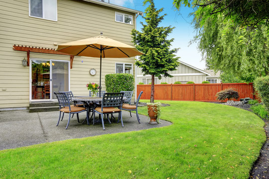 Patio Area With Table Set And Umbrella