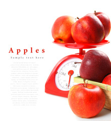 Apples on scales and in basket