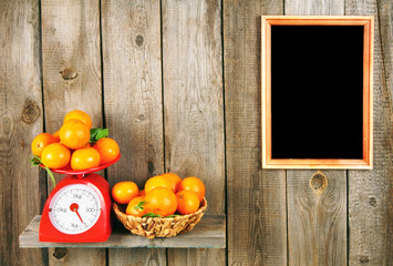 Tangerines on scales and in a basket