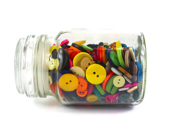 Colourful haberdashery buttons in a glass jar