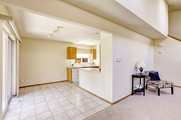 Bright rooms in empty house. Kitchen area with tile floor