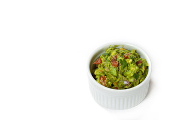 Bowl of Guacamole dip and nachos isolated on white background