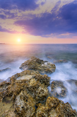 the gentle sun falling in the warm waters of summer sea